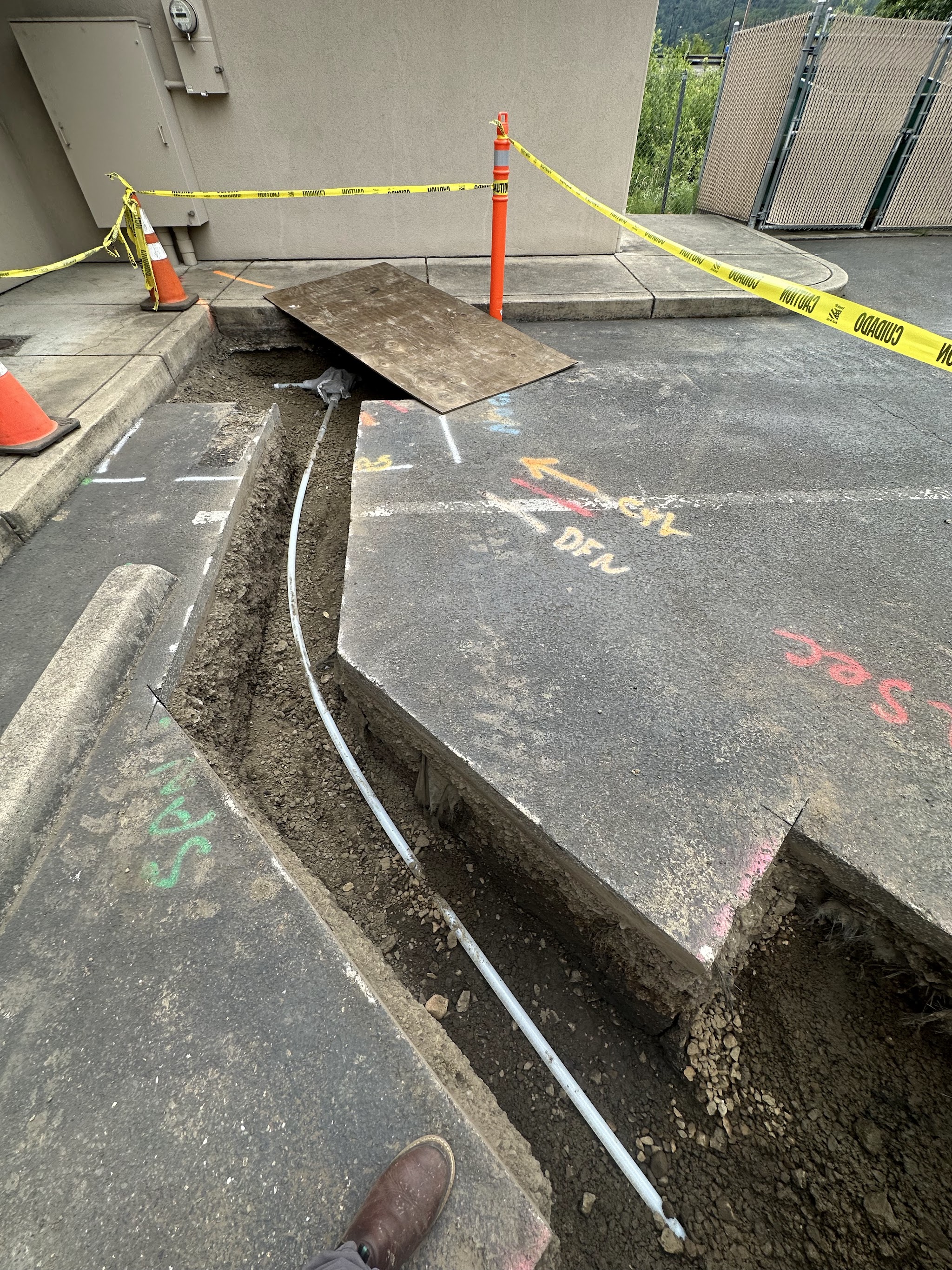 Trenching a new water line along a fence line in Roseburg