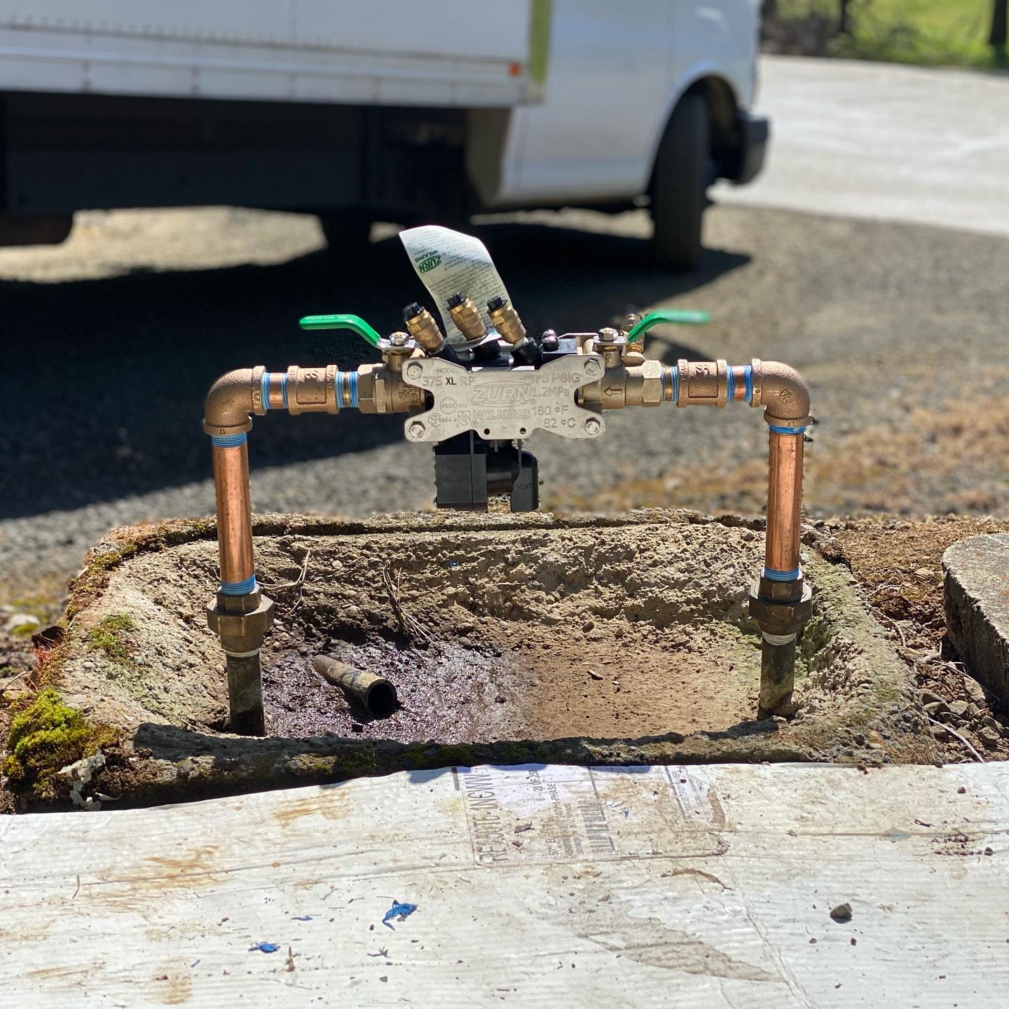 Backflow preventer install with the service van on site